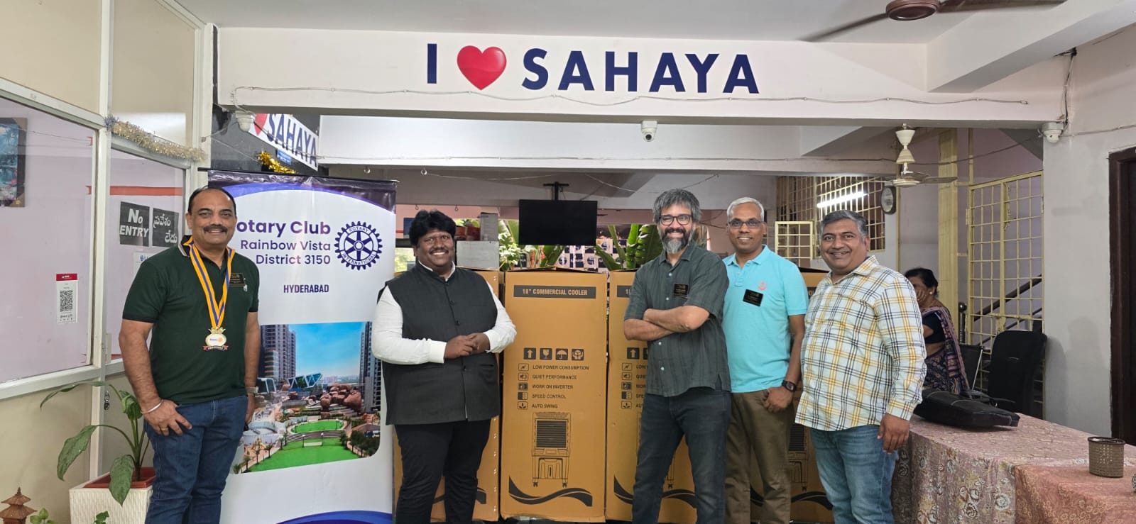Participants marking the donation of four air coolers at the old age home